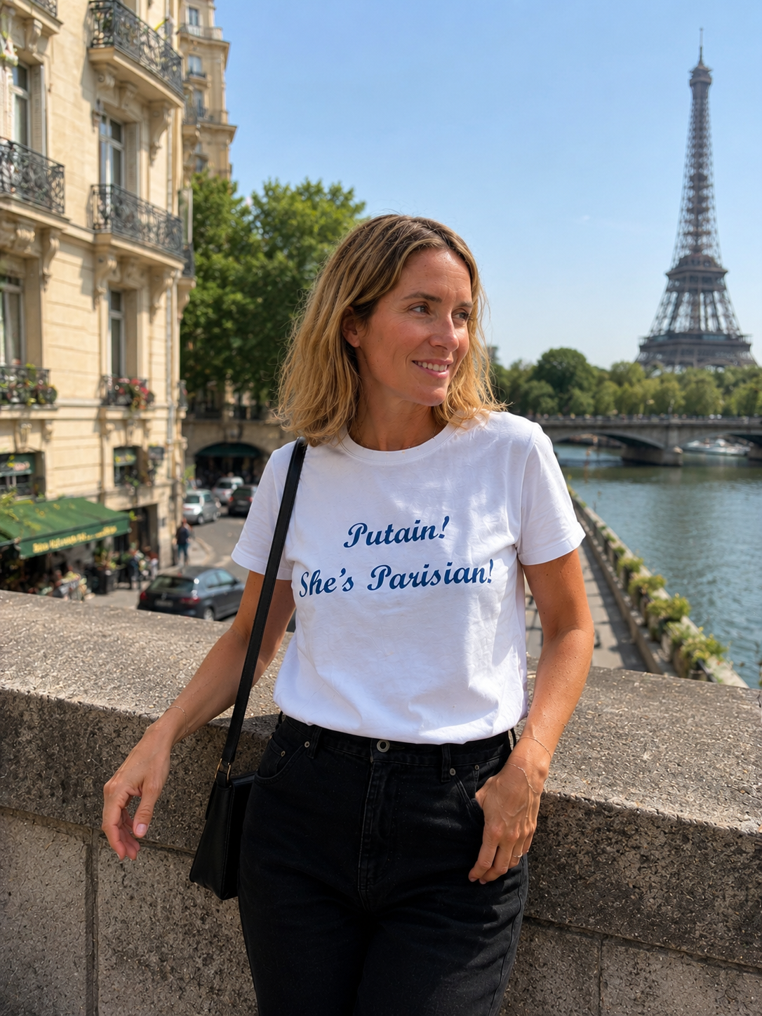 Woman wearing a white t-shirt with text in Paris, France.